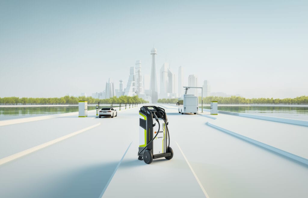 A futuristic cityscape features a sleek, robotic charger in the foreground on a wide, open road leading to the city. In the background, trees, modern buildings, a car, and a solar-powered structure can be seen under a clear blue sky.